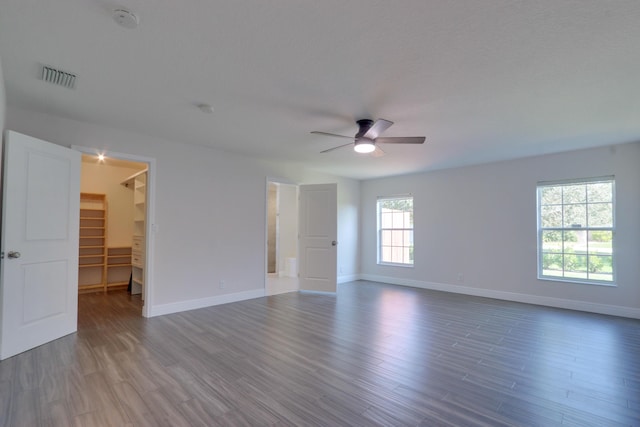 spare room with ceiling fan and wood-type flooring