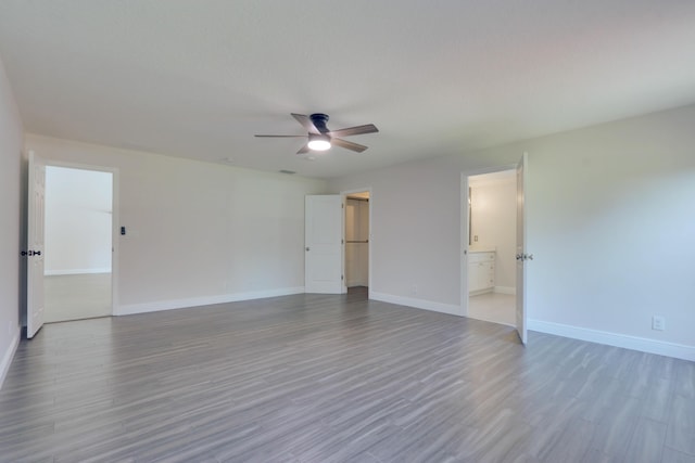 empty room featuring light hardwood / wood-style floors and ceiling fan