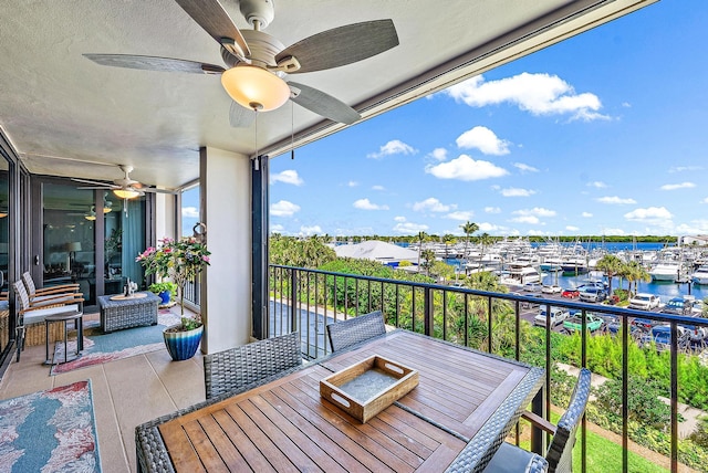 balcony featuring a water view