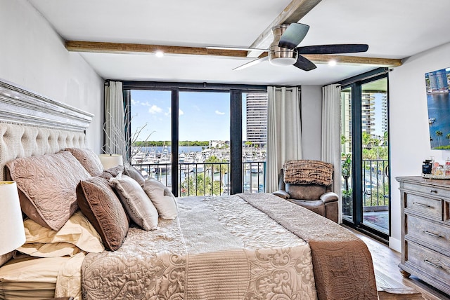 bedroom with access to exterior, floor to ceiling windows, ceiling fan, beam ceiling, and light hardwood / wood-style floors