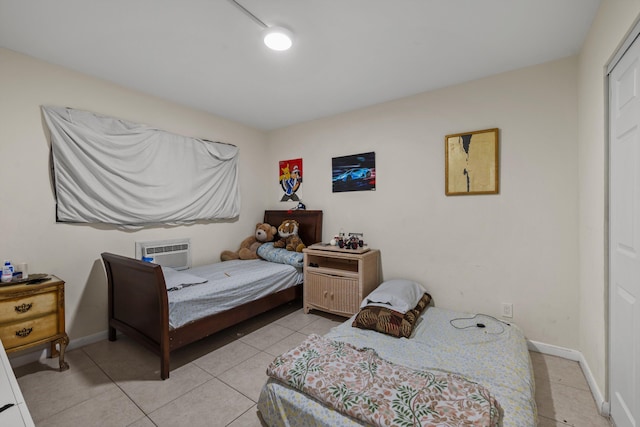 tiled bedroom with a wall unit AC