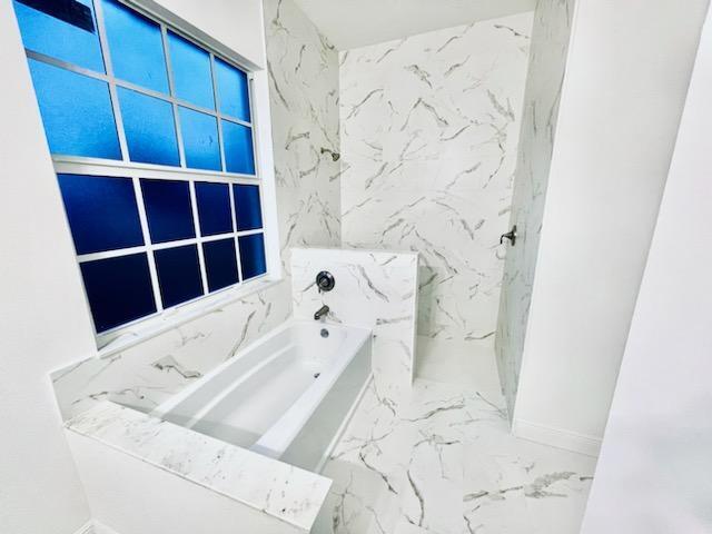 bathroom featuring a bathtub