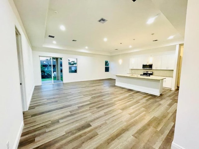 unfurnished living room featuring light hardwood / wood-style flooring