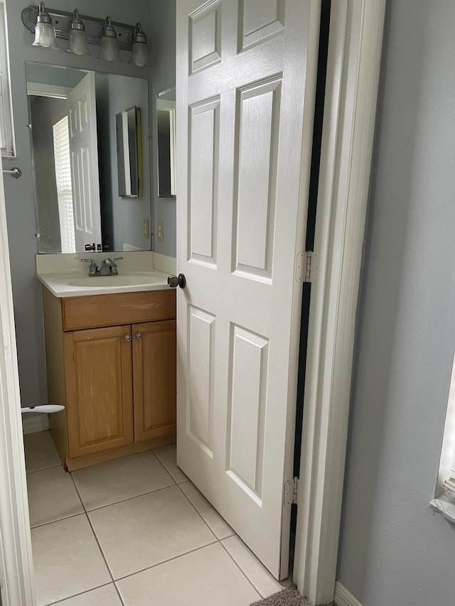 bathroom with vanity and tile patterned floors