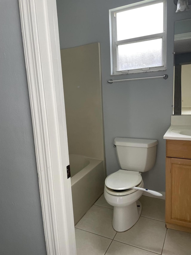 full bath with toilet, tile patterned flooring, and vanity