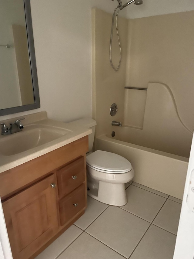 full bathroom featuring tub / shower combination, toilet, vanity, and tile patterned flooring