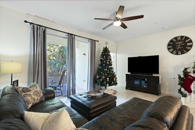 living room with ceiling fan and light tile patterned floors