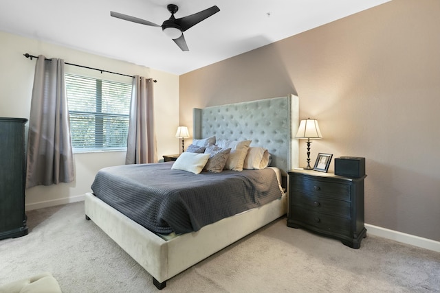 bedroom featuring ceiling fan and light colored carpet