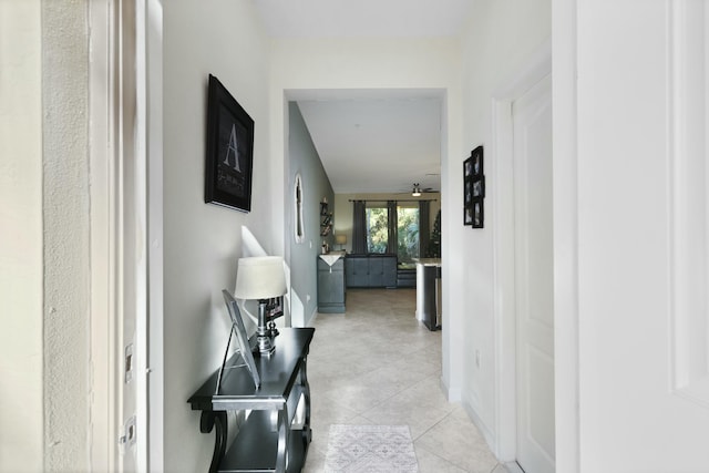 corridor featuring light tile patterned floors