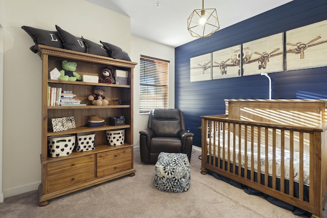 carpeted bedroom featuring a crib