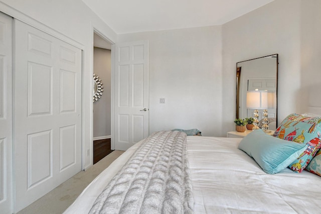 bedroom with carpet floors and a closet