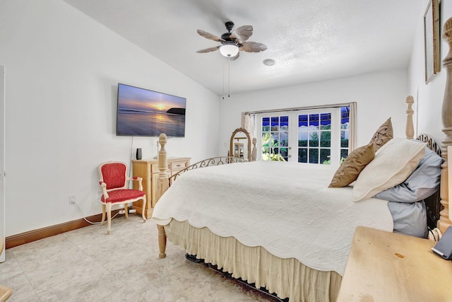 bedroom featuring a textured ceiling, ceiling fan, french doors, and vaulted ceiling