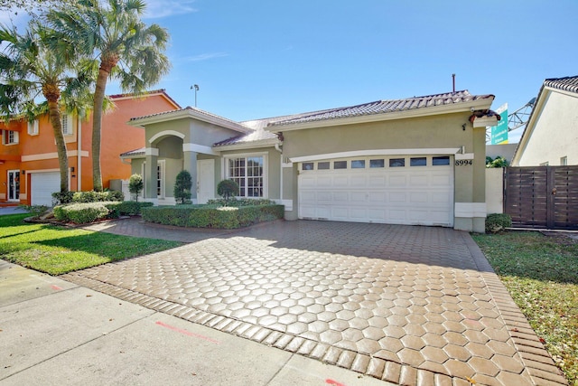 mediterranean / spanish house featuring a garage