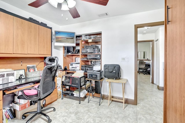 office space featuring ceiling fan and light tile patterned floors