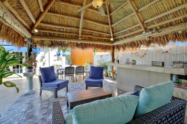 view of patio with a gazebo, ceiling fan, and an outdoor hangout area