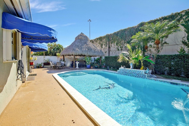 view of pool with a mountain view and a patio area