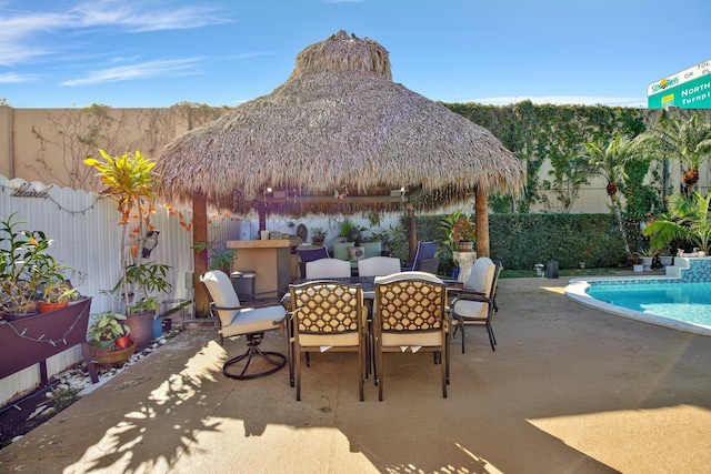 view of patio / terrace with a gazebo and a fenced in pool