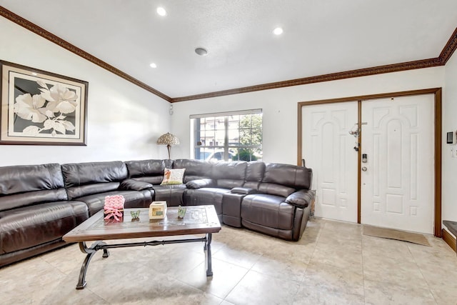 living room with a textured ceiling and ornamental molding