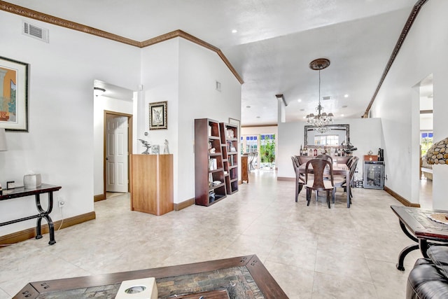 interior space featuring an inviting chandelier and crown molding