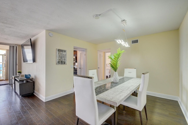 dining area featuring dark hardwood / wood-style floors