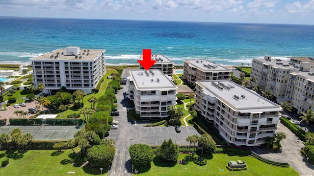 aerial view featuring a water view and a view of the beach