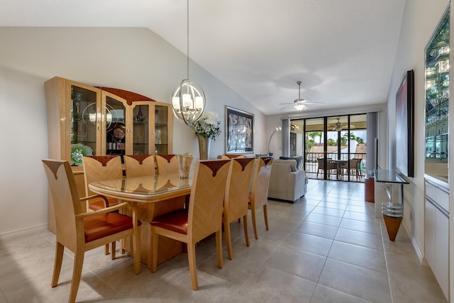 tiled dining area with vaulted ceiling and ceiling fan with notable chandelier