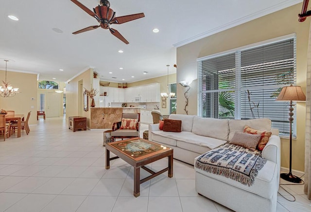 tiled living room with ceiling fan with notable chandelier and crown molding