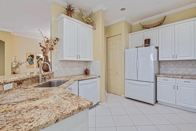 kitchen featuring white cabinetry, sink, white appliances, and backsplash