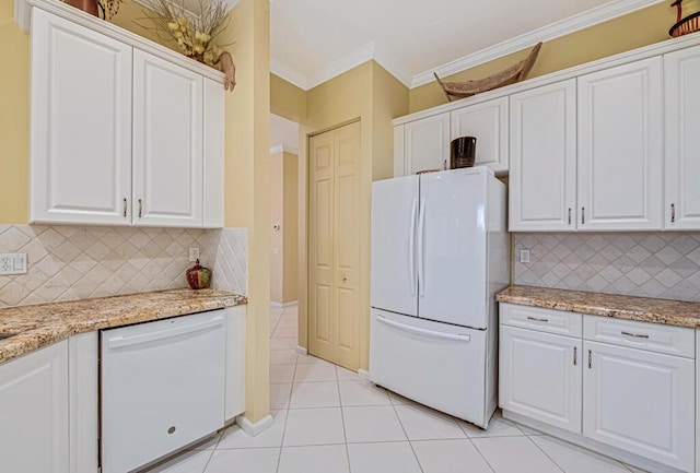 kitchen featuring white cabinetry, white appliances, light tile patterned floors, and decorative backsplash