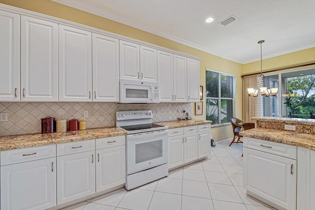 kitchen featuring pendant lighting, white appliances, white cabinets, and tasteful backsplash