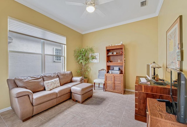 tiled living room with ceiling fan and crown molding