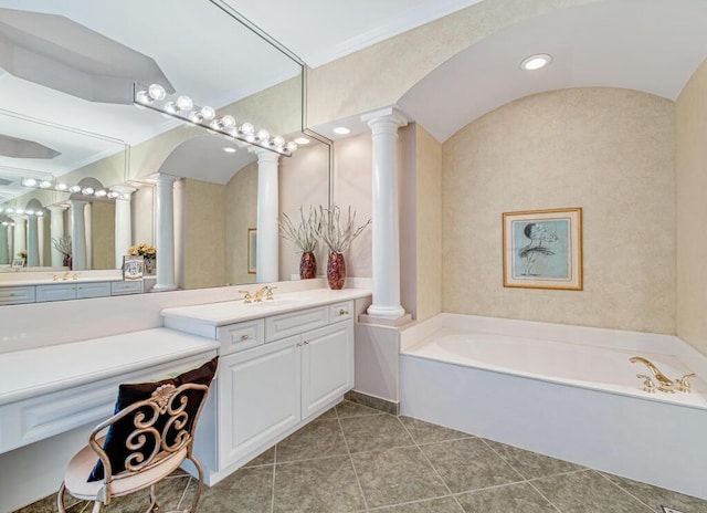 bathroom with vanity, tile patterned flooring, crown molding, and a tub