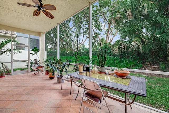 sunroom featuring ceiling fan