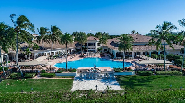 view of pool featuring a patio area and a lawn