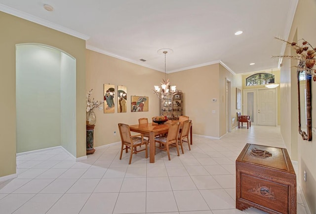 dining area featuring light tile patterned floors, a notable chandelier, and crown molding