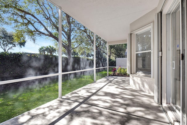 unfurnished sunroom featuring a wealth of natural light