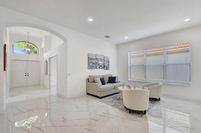 living room with a notable chandelier