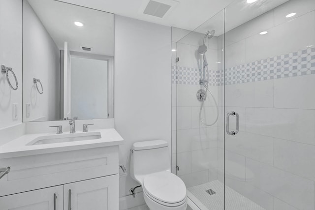 bathroom featuring vanity, toilet, and walk in shower