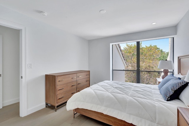 bedroom with light hardwood / wood-style floors