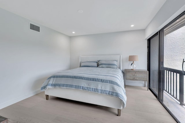 bedroom with light hardwood / wood-style flooring