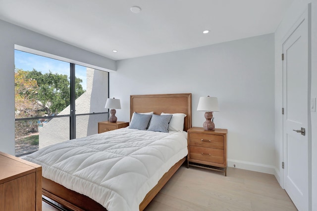 bedroom with light wood-type flooring