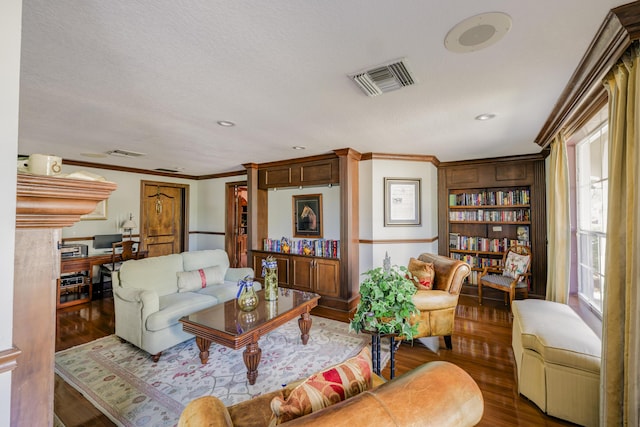 living room featuring hardwood / wood-style floors and ornamental molding