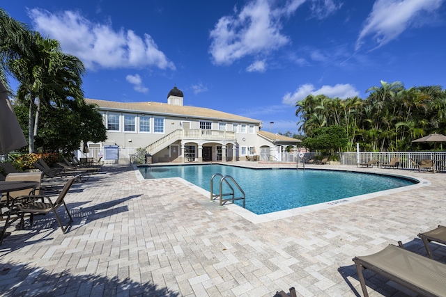 view of swimming pool with a patio