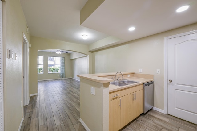 kitchen with kitchen peninsula, ceiling fan, sink, light brown cabinets, and dishwasher