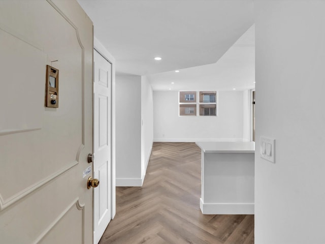 corridor featuring light parquet flooring