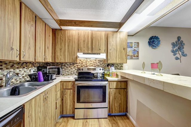 kitchen featuring electric range, sink, black dishwasher, a textured ceiling, and decorative backsplash