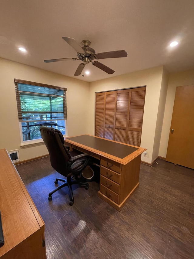 office area with ceiling fan and dark hardwood / wood-style floors