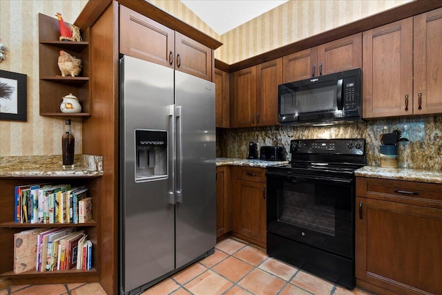kitchen with tasteful backsplash, wallpapered walls, light tile patterned floors, open shelves, and black appliances