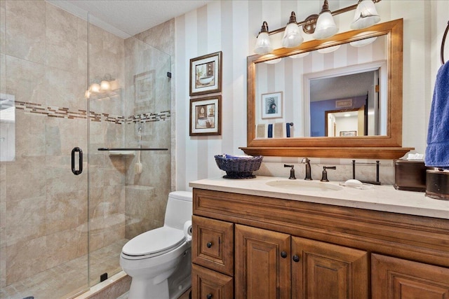 full bath featuring a stall shower, toilet, and vanity