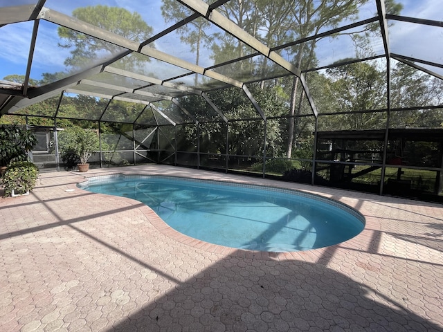 view of pool with a lanai and a patio